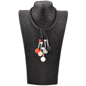 Handmade gothic silicone choker displayed on black dress form, showcasing matte bead decorations and pendant clusters against dark background