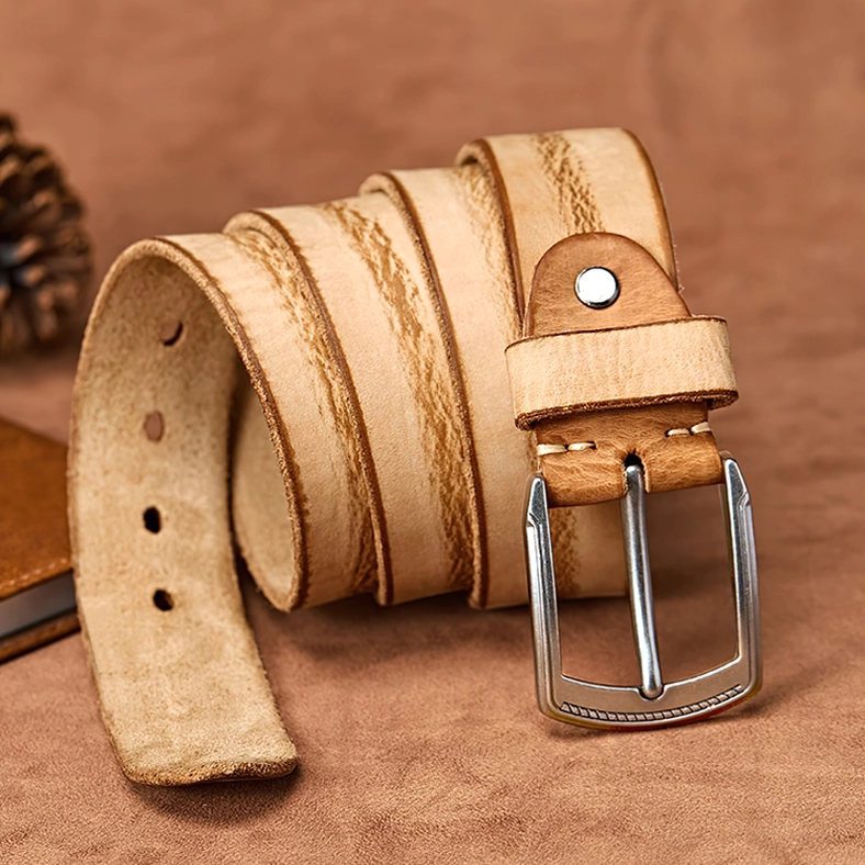 Handcrafted cowhide gothic belt in warm neutral tone with antique alloy buckle, side profile view emphasizing belt width and leather craftsmanship