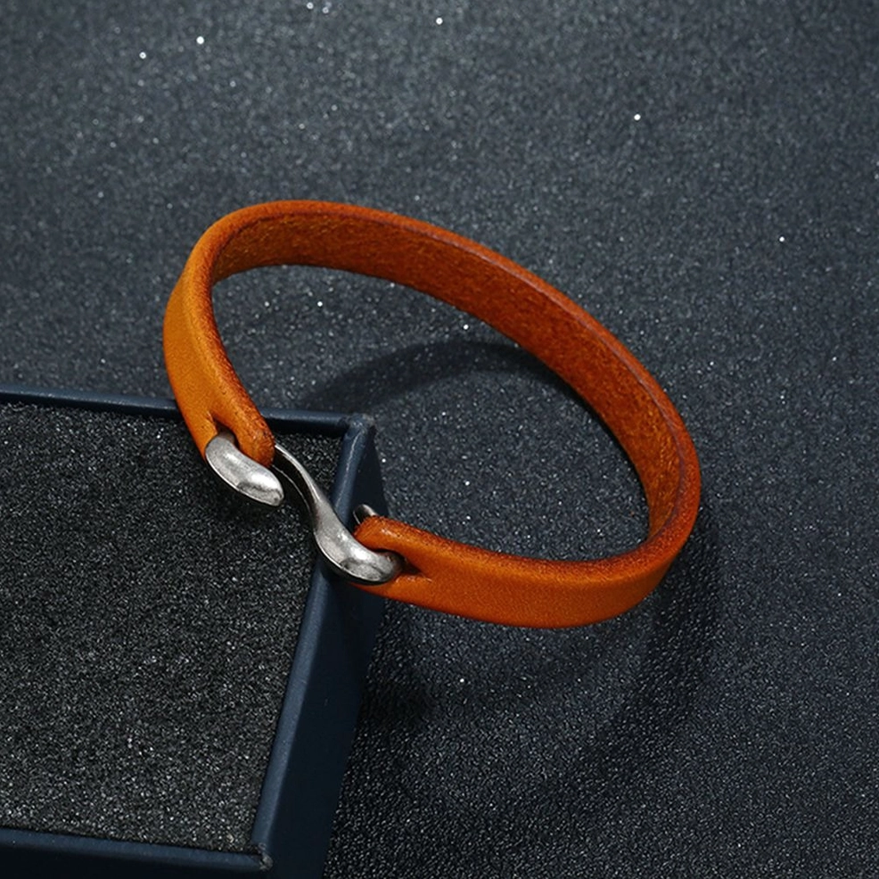 orange genuine leather cuff bracelet with hook closure in jewelry display box - dark aesthetic bangle