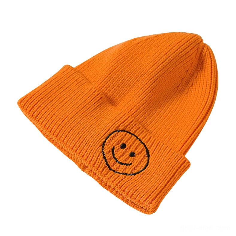 Orange ribbed knit beanie with black smiley embroidery, unconventional gothic winter hat