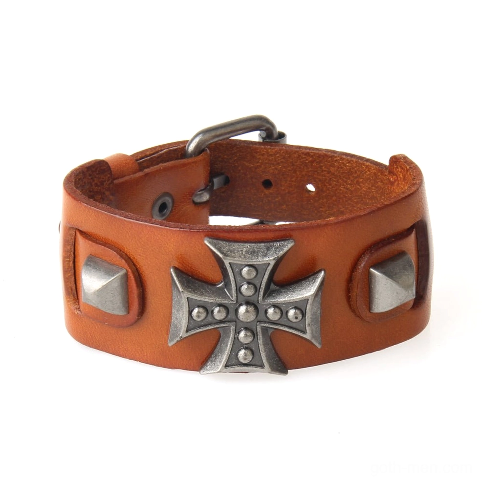 Orange tan leather gothic cross bracelet flat lay side view with adjustable toggle clasp and decorative metal details