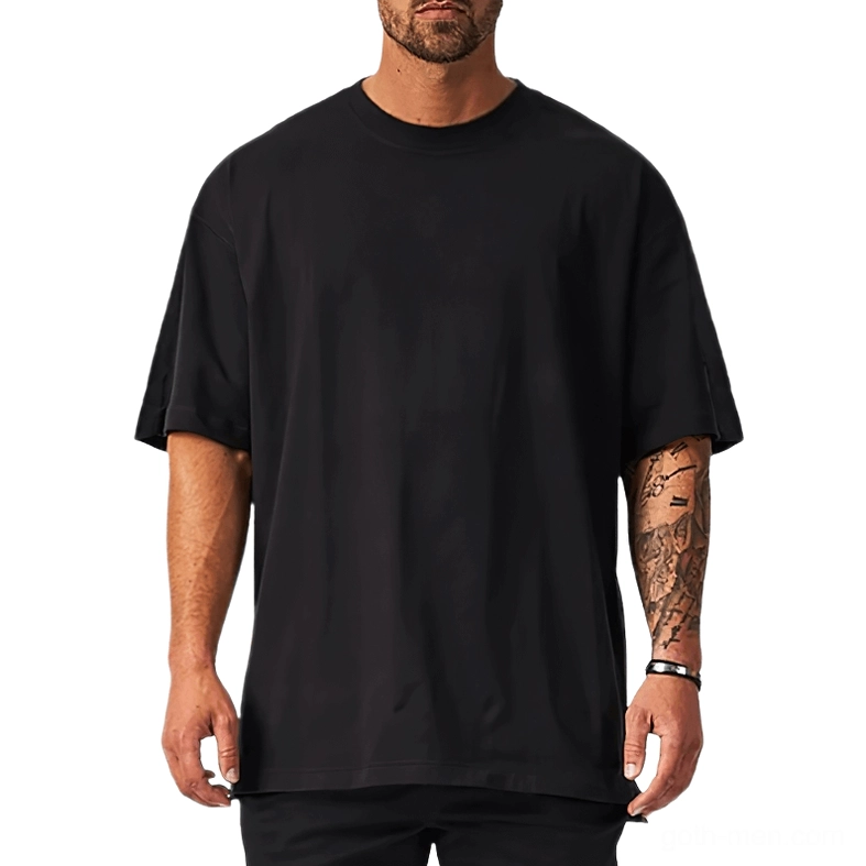 Black oversized gothic crew neck t-shirt with dropped shoulders on tattooed male model, front view