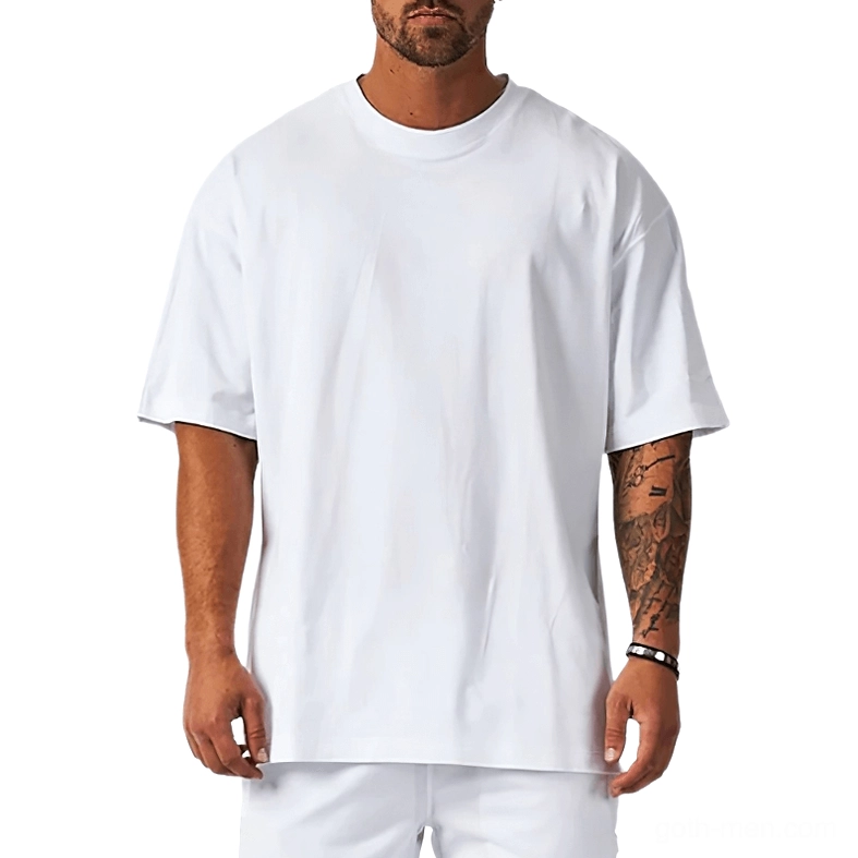 White oversized gothic t-shirt with dropped shoulders on tattooed male model, front view