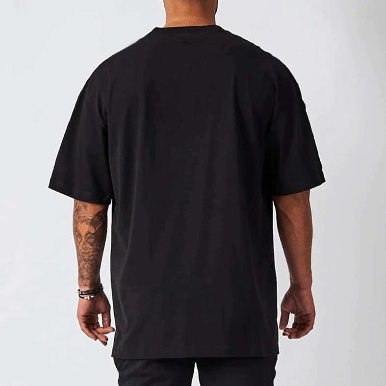 White bone oversized gothic crew neck tee on tattooed male model, casual styling