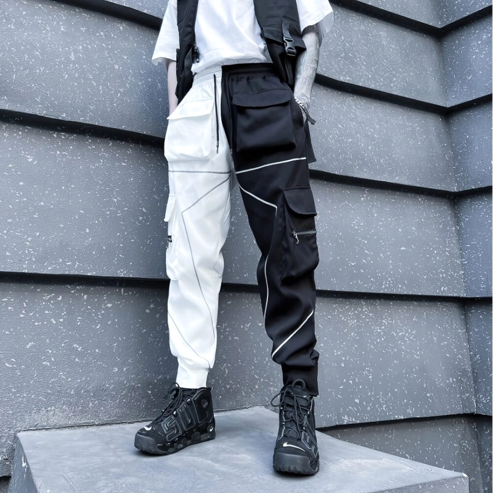 Gothic patchwork cargo pants full length view showing reflective accents and industrial design elements
