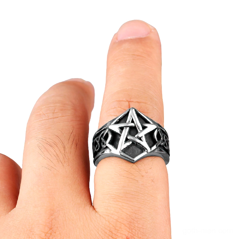 Pentagram ring worn on finger, side profile view showing vintage silver-black finish and Celtic details
