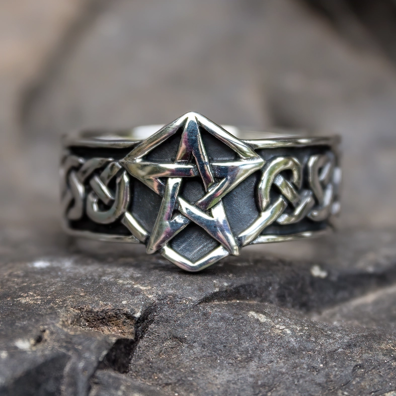 Gothic pentagram stainless steel ring on natural stone with engraved Celtic knot band details
