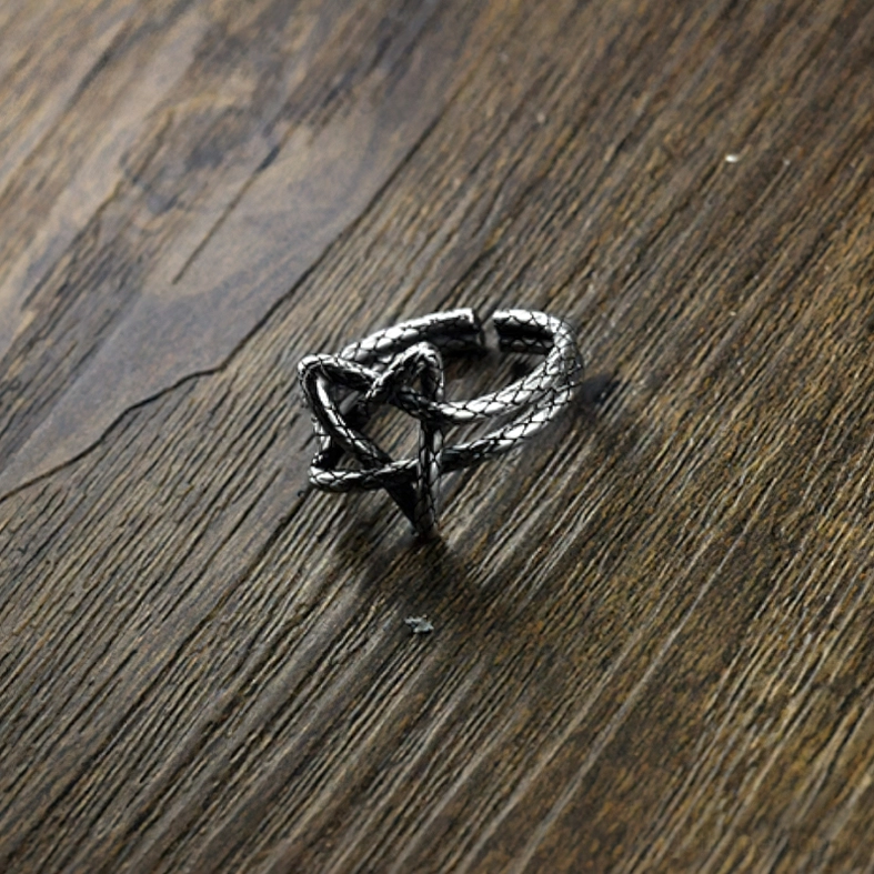 Braided texture pentagram ring oblique angle wooden background sterling silver