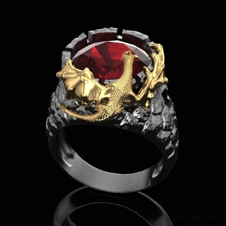 Silver-toned perched dragon ring with big red central gemstone on rugged textured band, goth jewelry