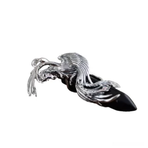 Sterling silver phoenix pendant with black obsidian stone, detailed side perspective showcasing carved feather work and metal craftsmanship