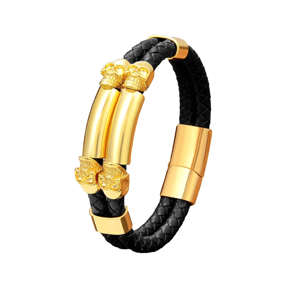 Polished gold skull leather bracelet featuring dual skull centerpiece and magnetic closure
