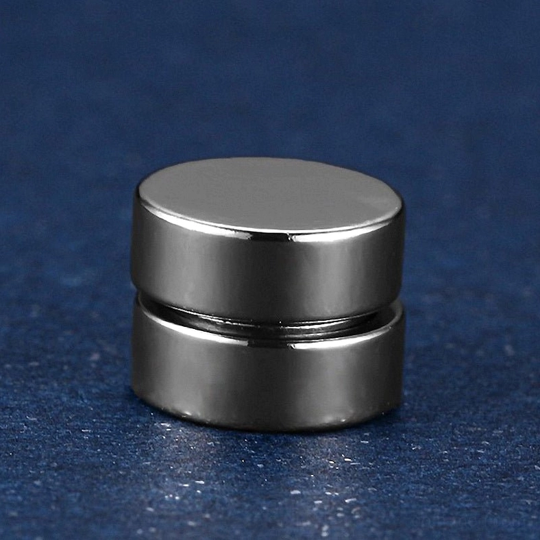 High-polished magnetic stud earrings reflecting light showing premium finish quality