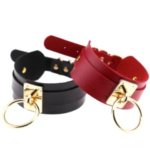 Black and wine red PU leather bondage chokers displayed together, showing adjustable buckle straps and gold metal fittings