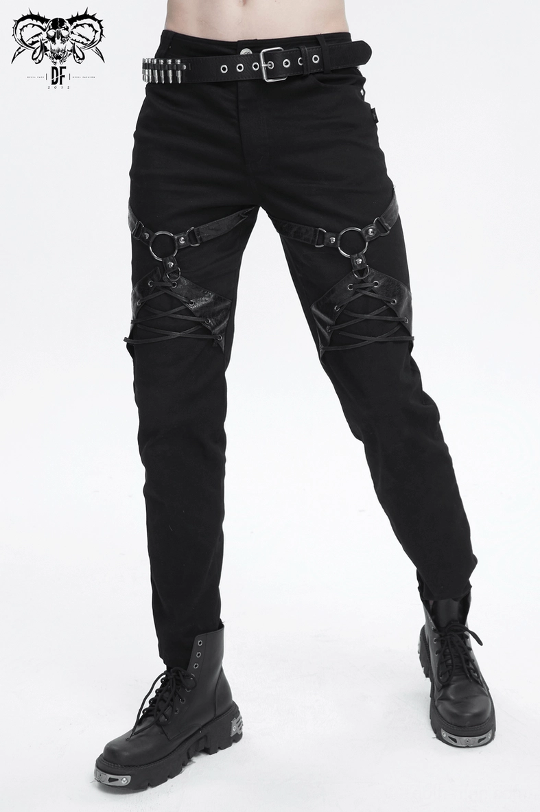 Punk rock fitted black leather harness pants worn by model showcasing overall aesthetic