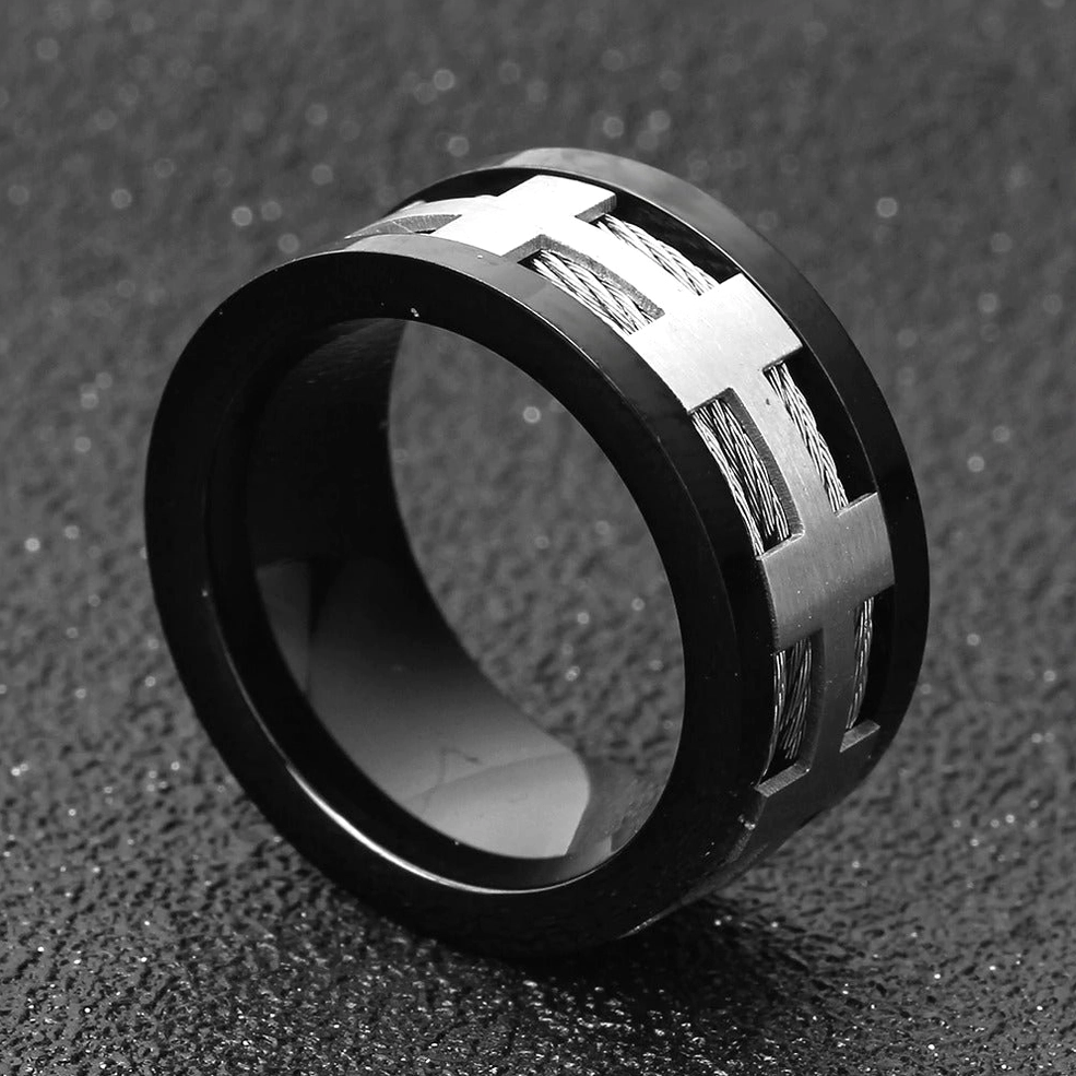 Oblique side view of black matte punk ring revealing braided inlay details and IP black coating on dark surface