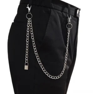 Heavy curb chain punk wallet chain worn on black pants waist, demonstrating thick silver metal construction and gothic styling