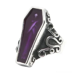 Coffin-shaped gothic ring front view showcasing silvery stainless steel and purple enamel detail