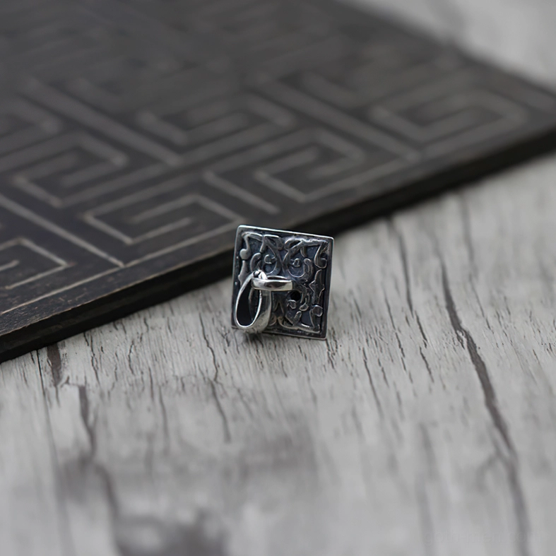 Front flat view of silver pyramid pendant showing square base construction and pendant attachment loop