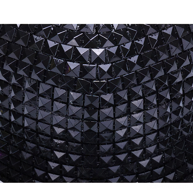 Pyramid studded snapback cap displaying texture and three-dimensional metallic spikes