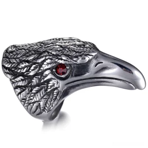 Raven head 316L stainless steel gothic ring with crimson gemstone eye, front view on white background