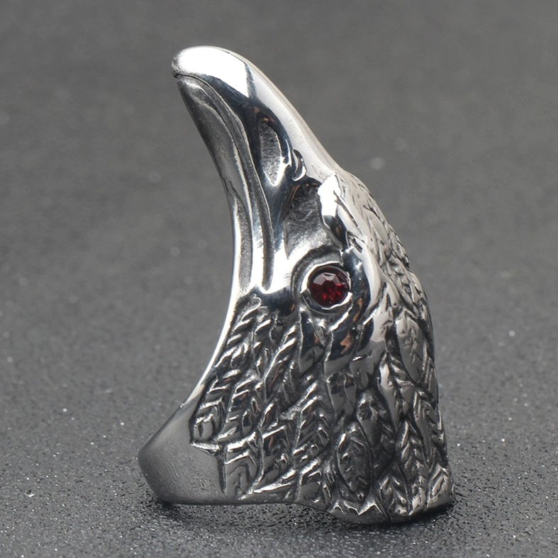 Raven head ring back view showing inner structure feather details and crimson gem