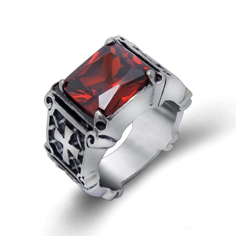 Red gemstone celtic cross gothic ring, side angle displaying carved cross patterns and faceted stone setting