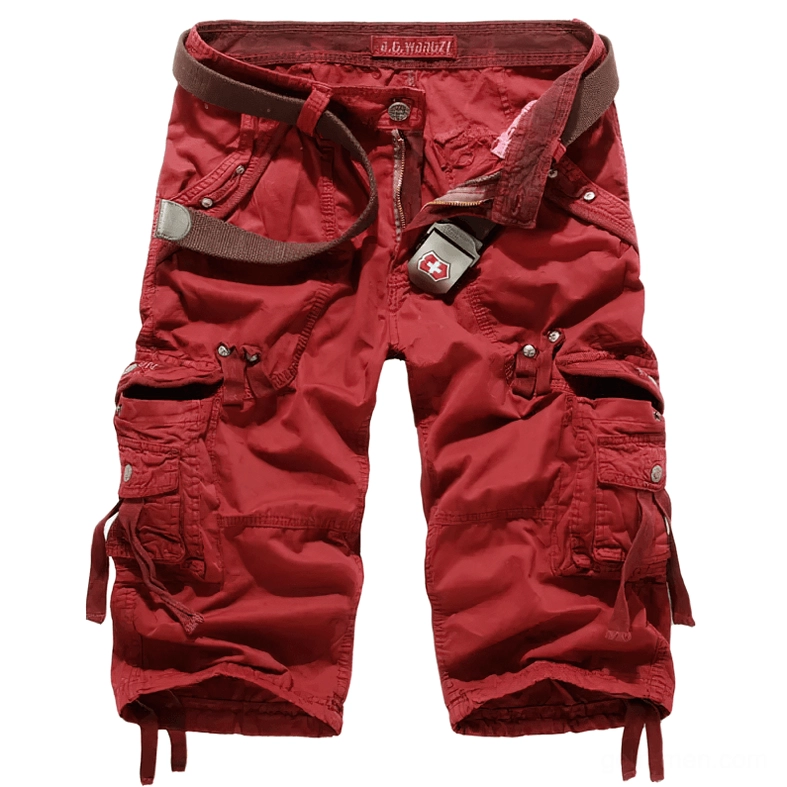 Red gothic cargo capri shorts flat lay - bold alternative military style with metal accents