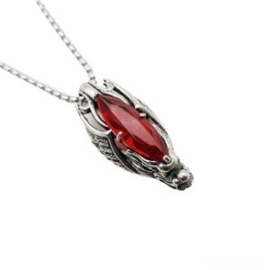 Red garnet stone dragon head pendant necklace with stainless steel punk hollow dragon design, side angle view