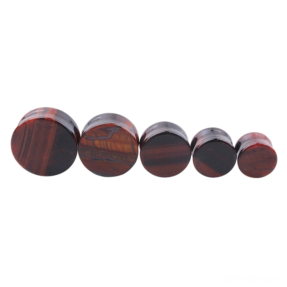 Red tigerite alabaster stone ear plugs collection in progressive sizes, showcasing the smooth polished finish and natural grain pattern typical of gothic alternative body jewelry