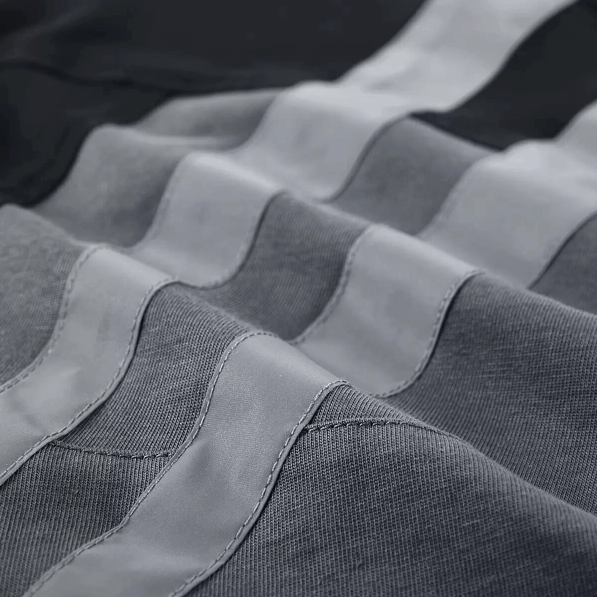 Reflective gray stripe splicing detail layered on black fabric base gothic tee