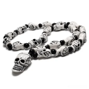 Retro white aged skull beads with cross-etched details gothic necklace pendant overhead view