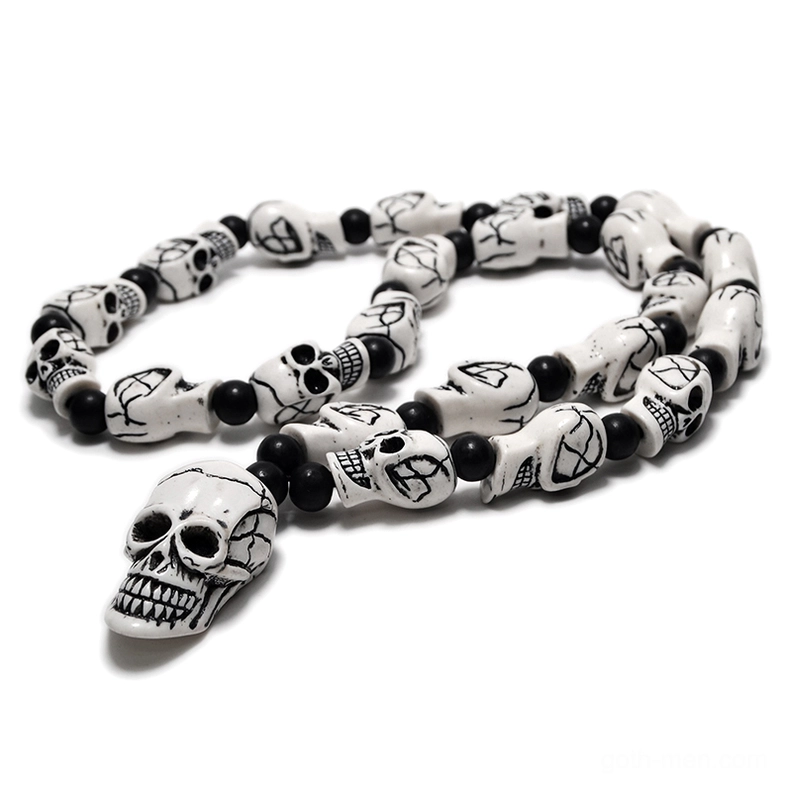 Retro white aged skull beads with cross-etched details gothic necklace pendant overhead view