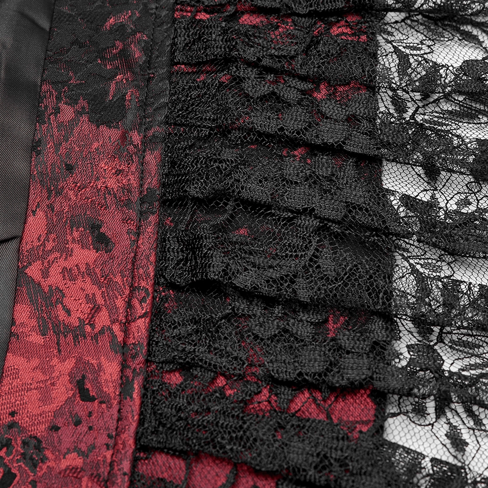 Detailed close-up of gothic tailcoat front placket showing layered ruffled lace and jacquard base