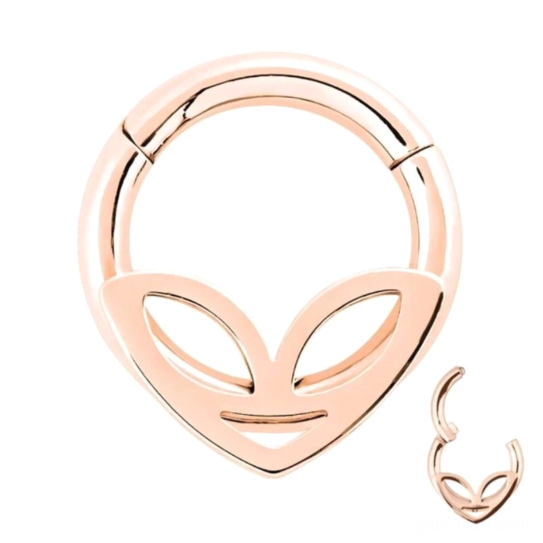 Rose gold alien clicker nose ring studio shot - warm-toned plated finish with alien face cutout design