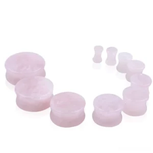 Front view of rose quartz ear plug gauge showing smooth polished pink stone surface, professional double-flared gauge design
