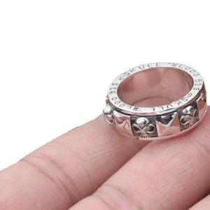 S925 rotating skull spinner ring top-side view with engraved details and vintage oxidized silver finish