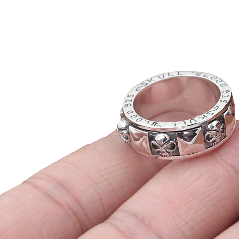 S925 rotating skull spinner ring top-side view with engraved details and vintage oxidized silver finish