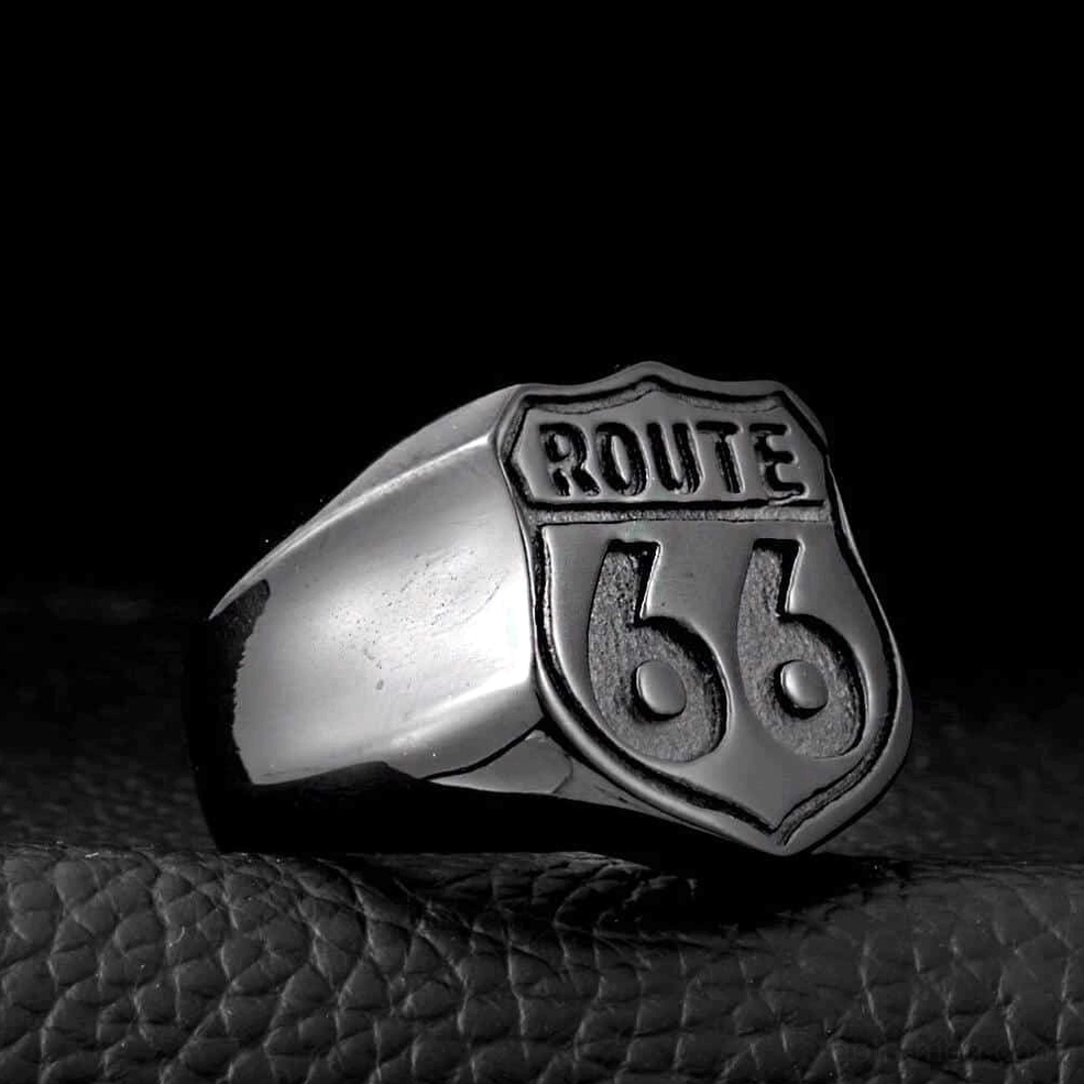 Dark silver Route 66 embossed shield ring on leather textured background, gothic biker style