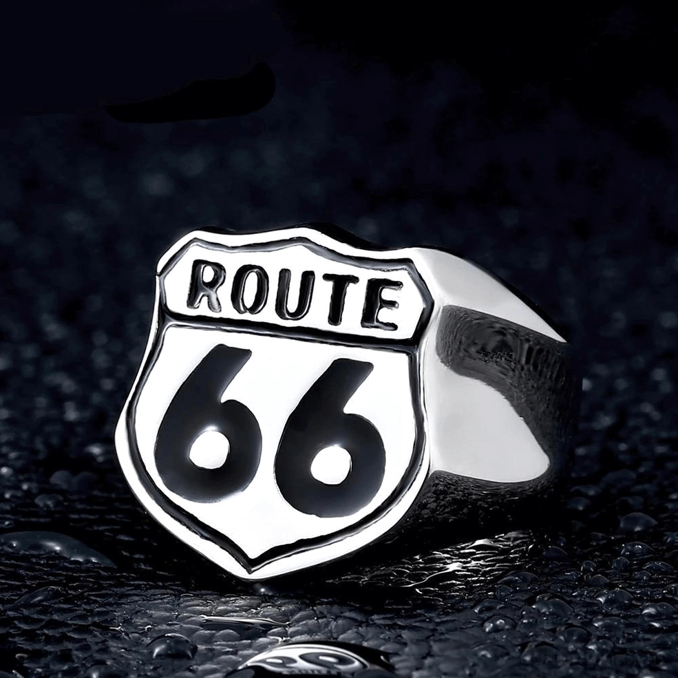 Silver Route 66 biker ring with high-contrast black enamel emblem on dark water drop background