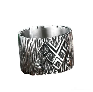 Wide band gothic rune ring featuring notched edges and embossed rune motifs, front-facing view on white background