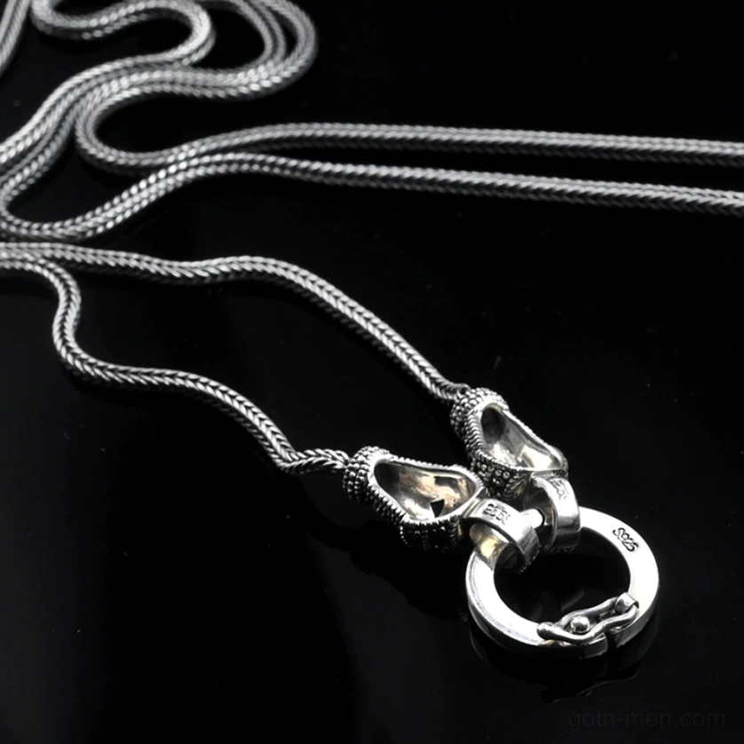 S925 sterling silver chain necklace close-up flat lay on black background showing polished silver finish, double metal clasp and S925 hallmark
