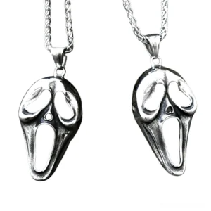 Screaming face pendant with silver twisted metal chain overhead flat lay perspective