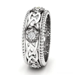 Silver Celtic knot zircon gothic ring with beaded rim and interwoven Celtic pattern, side oblique view showing radiant cubic zircon center stone