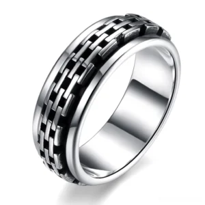 Sterling silver chain link biker ring with black antiqued accents, 3/4 side view showing detailed woven texture and gothic aesthetic