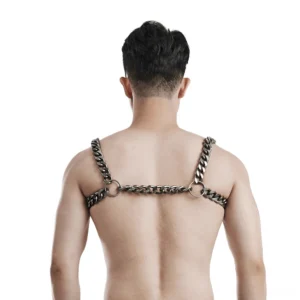 Rear view of gothic silver chain harness showing back chain rings and shoulder strap connection points on male model