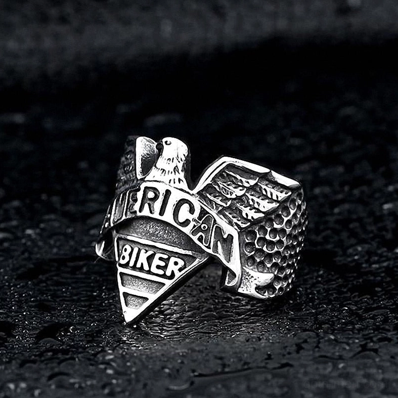 All-silver gothic eagle ring front view with dramatic water droplet background lighting