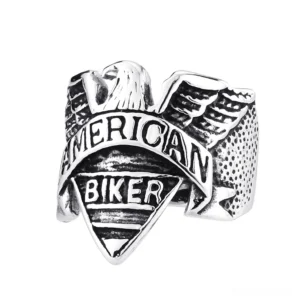 Sterling silver gothic eagle biker ring with detailed wing engravings and band texture on white background