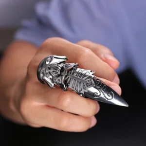 Silver gothic skull claw armor ring worn on index finger - close-up side view showcasing articulated structure