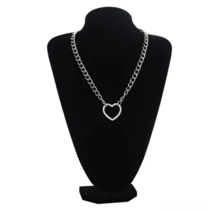 Silver hollow heart gothic chain necklace displayed on black jewelry mannequin, polished silver curb chain with hollow heart pendant front view