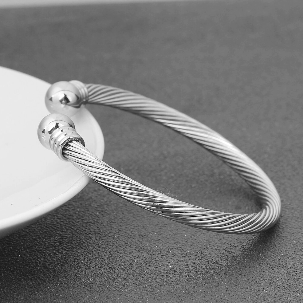 Silver open cuff twisted cable bracelet full view, industrial gothic bangle detail shot